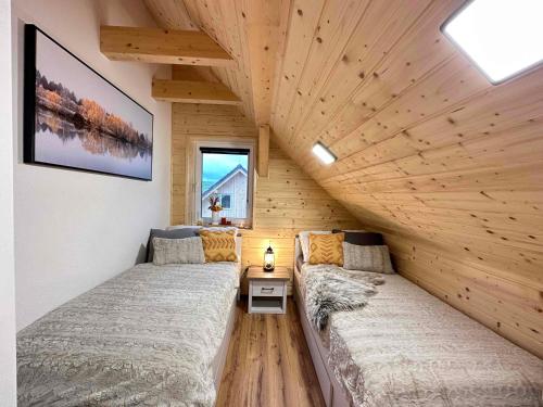 Postel nebo postele na pokoji v ubytování Roubený dvůr