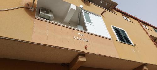 a side view of a building with a window at Clausis in Parghelia