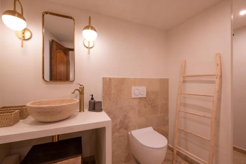 a bathroom with a sink and a toilet at Pick A Flat's Townhouse in Saint-Tropez - Rue Sainte-Barbe in Saint-Tropez