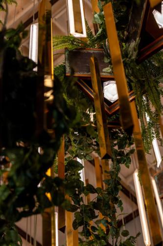 a ceiling with a bunch of green plants at The Delphi Downtown LA in Los Angeles