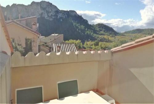 a balcony with a view of a mountain at La Parenthèse in Tautavel