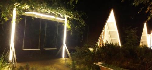a house with lights on the side of it at night at Tuyết Hoa Hòn Bồ Homestay in Da Lat