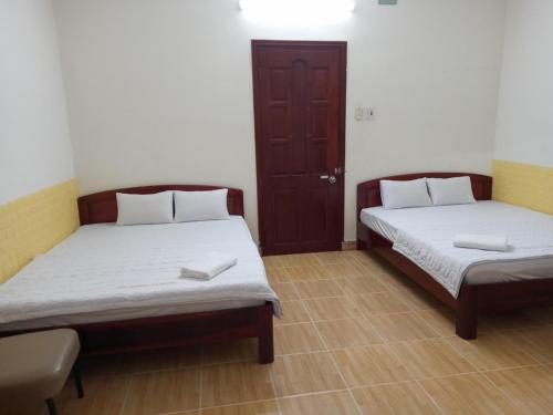 Posteľ alebo postele v izbe v ubytovaní MOTEL Ngọc Thuận