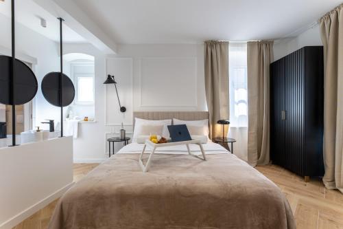 Postel nebo postele na pokoji v ubytování Palace Luxury Suites