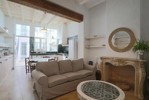 a living room with a couch and a table at Apartamentos Castillo Quince in Cartaya
