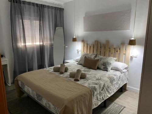 Säng eller sängar i ett rum på Apartamento Vistafranca