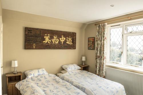 Postel nebo postele na pokoji v ubytování Ward Avenue B&B