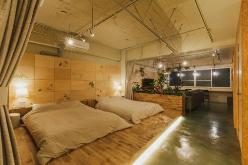 a large bedroom with two beds in it at DENCHI TOKYO - Private Designer Stay in Asakusa in Tokyo