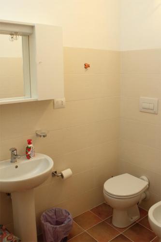 a bathroom with a toilet and a sink at B&B Villa Angela in San Salvo