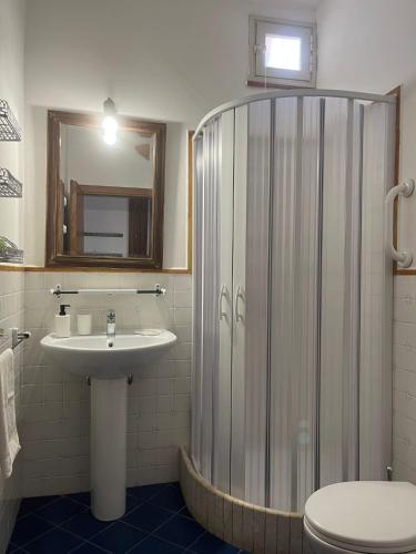 a bathroom with a shower and a sink at Savoia in San Vito lo Capo