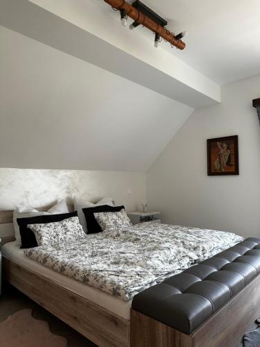 a bedroom with a large bed in a room at Hiša Srečo in Begunje na Gorenjskem