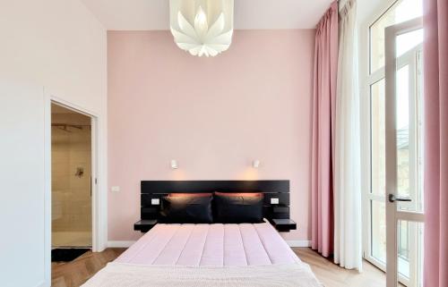Кровать или кровати в номере Glamour Suite Cagliari