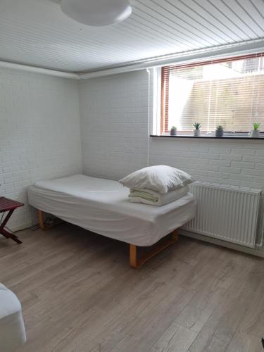 Postel nebo postele na pokoji v ubytování Feriehuse Hvide Sande