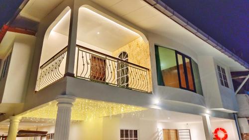 a building with a balcony with lights on it at JB City Villa (Private Pool) in Johor Bahru