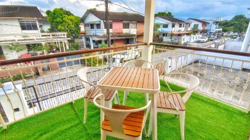 a balcony with a table and chairs on a balcony at JB City Villa (Private Pool) in Johor Bahru