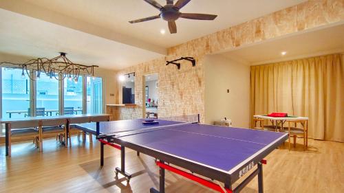 a living room with a ping pong table in it at JB City Villa (Private Pool) in Johor Bahru