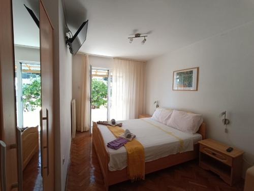 Postel nebo postele na pokoji v ubytování Rooms Rita