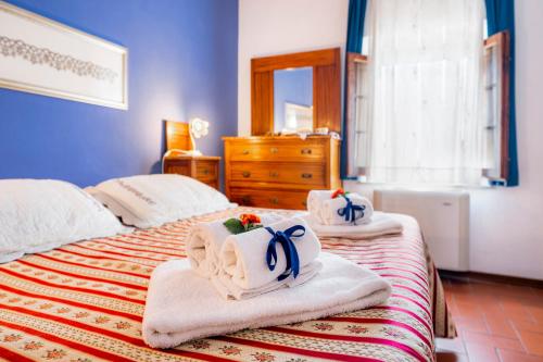 Ένα ή περισσότερα κρεβάτια σε δωμάτιο στο Casa Pietraia