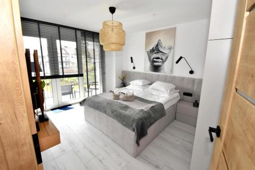 Katil atau katil-katil dalam bilik di Apartamenty Blanca