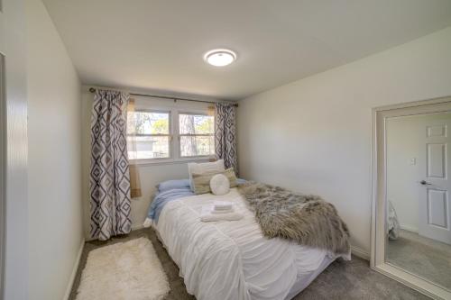 a small bedroom with a bed and a window at Chicago Escape Near Navy Pier and Shedd Aquarium! in Chicago