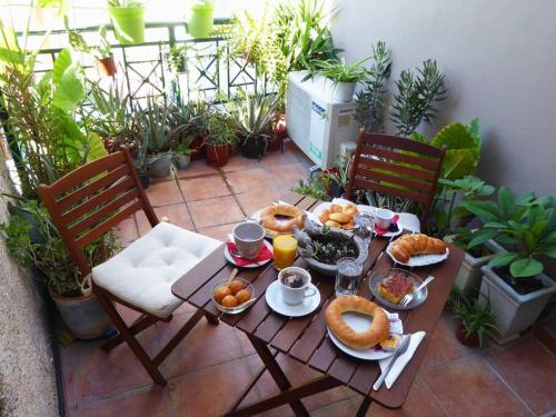 a table with breakfast food on a patio at #Tyrtaiou Modern Design Studio in Mytilini