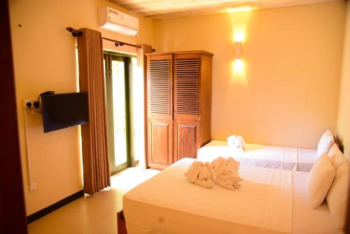 Ένα ή περισσότερα κρεβάτια σε δωμάτιο στο Villa Olinia