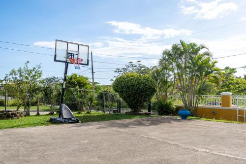 an empty parking lot with a basketball hoop at Casamares Private Room Coral with Pool and Barbecue 5 min to Boqueron and Beaches in Cabo Rojo