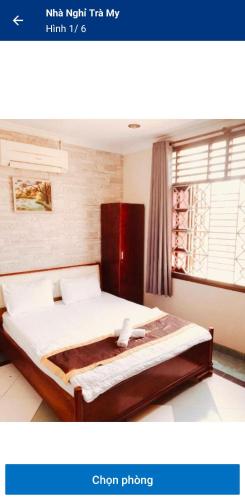 Un pat sau paturi într-o cameră la Nhà nghỉ trà my