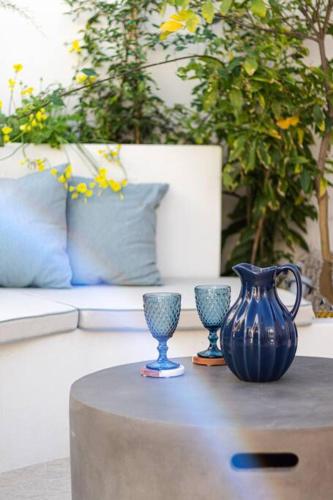 two blue vases sitting on a table in a living room at Koroneia Residence in Koroni