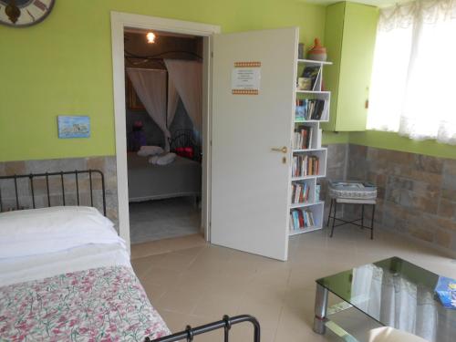 Ένα ή περισσότερα κρεβάτια σε δωμάτιο στο Casale Grandangolo