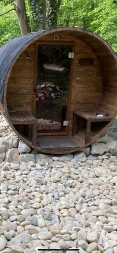 a small wooden building on a pile of rocks at Villa Romana in Pezinok