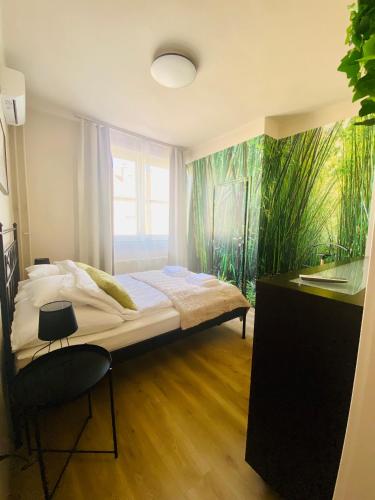 a bedroom with a bed and a fish mural at City Home in Debrecen