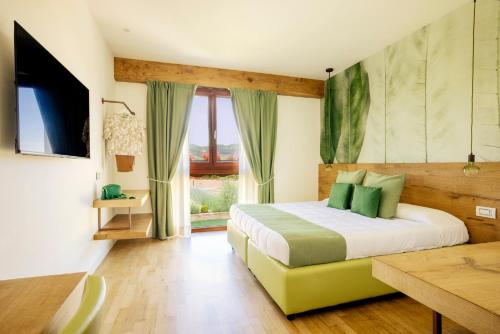 Ένα ή περισσότερα κρεβάτια σε δωμάτιο στο Agrirelais Collelago