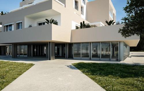 a large white building with a walkway at Casa Rita in Brescia