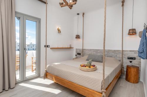 A bed or beds in a room at Sunshine Plaka Naxos
