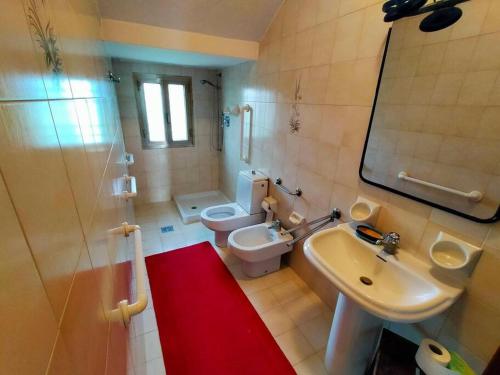 a bathroom with a sink and a toilet and a shower at Ca' Molino Giare 1 in Mira