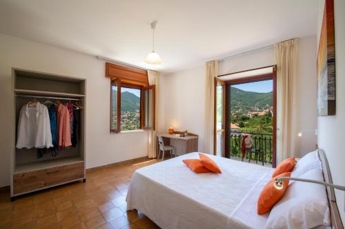 a bedroom with a bed and a balcony at I colori della Luna in Agerola