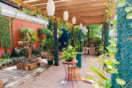 a patio with a bunch of potted plants at Isabelle Garden Villas 517 in Manila