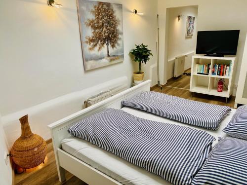 Ένα ή περισσότερα κρεβάτια σε δωμάτιο στο Köln City Apartments