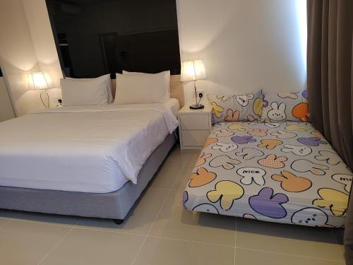 a bedroom with a bed with a blanket with animals on it at Hilltop Service Apartment at Genting Highland in Genting Highlands