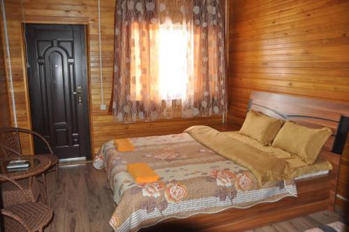 Tempat tidur dalam kamar di Арасан Алаколь