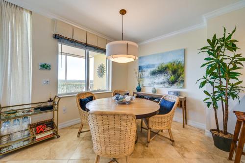 a dining room with a table and chairs at Estero Resort Condo with 2 Pools and Tennis Center! in Estero