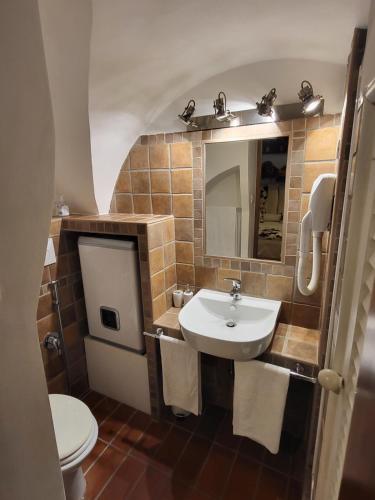 a bathroom with a sink and a toilet at The Rabbit Hole in Rome