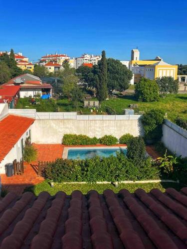 a view from the roof of a house with a swimming pool at Oceans house - Pool, Sauna, 26 Sleeps, 7m to beach in Carcavelos