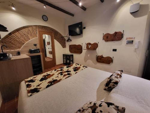 a bedroom with a large bed with cow pillows on it at The Rabbit Hole in Rome