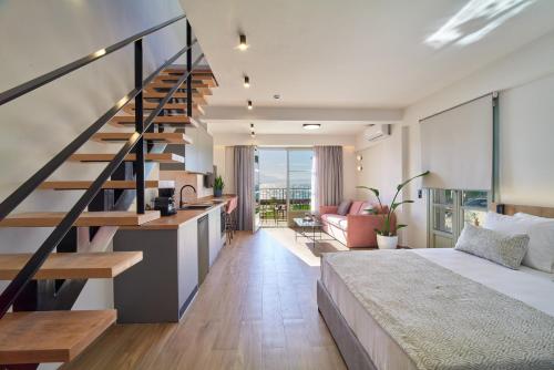 a bedroom with a large bed and a staircase at PORTA SQUERO Premium Suites in Rethymno Town