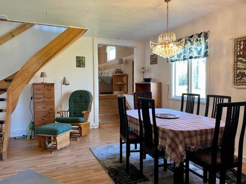 a dining room with a table and chairs at Holiday Home Bengtsfors in Bengtsfors