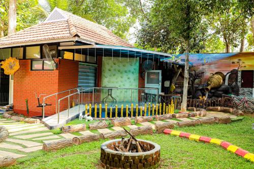 a house with a garden in front of it at Belljem Homes -your own private resort -4 BHK FF in Trichūr