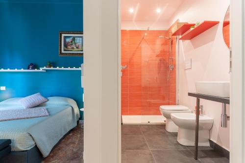 a bathroom with a toilet sink and a shower at Libertà #102 - Guest House Palermo in Palermo