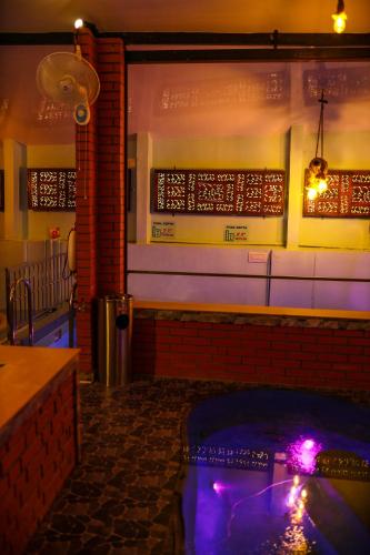 a room with a hot tub in a bar with lights at Belljem Homes -your own private resort -4 BHK FF in Trichūr